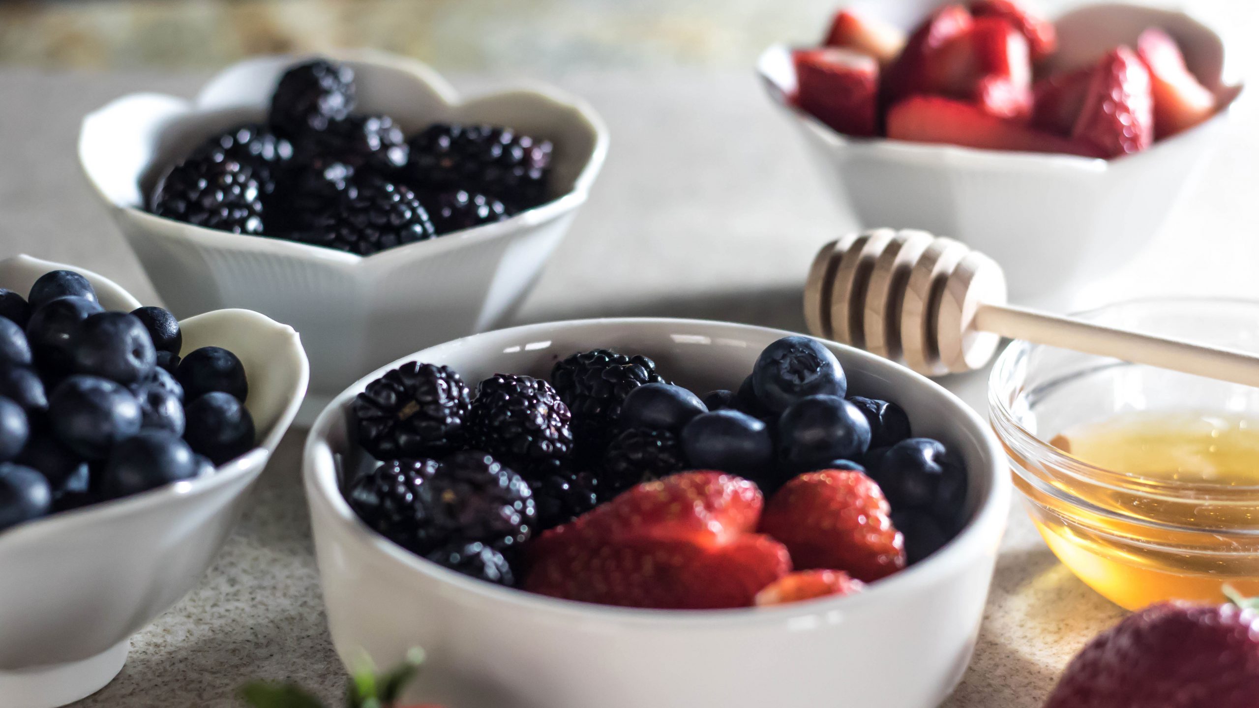 Fresh berries, whole cream, and raw honey make this simple treat delectable.